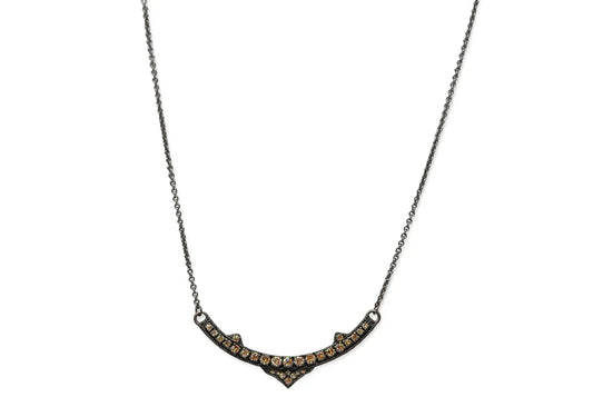 Gunmetal sterling silver 16.5" necklace featuring a pave pointed curved bar with champagne diamonds