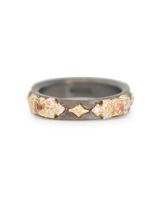 18k yellow gold and blackened sterling silver crivelli and scroll stack band with Peach Imperial Topaz, white and champagne diamonds. Dimensions: Band Width: 0.17" (4.35mm) RING Size 7