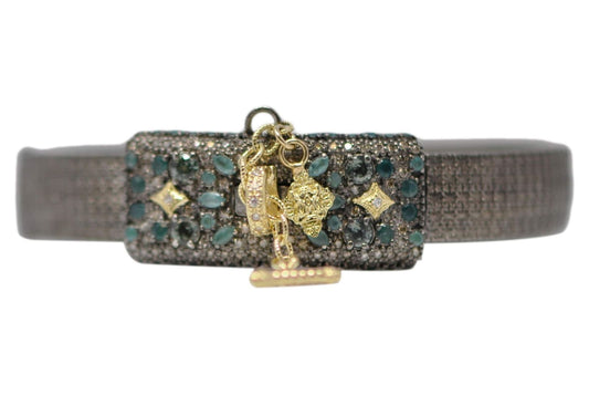 18k yellow gold and grey sterling silver textured huggie with pave double lock closure and safety chain with blue sapphires, grandidierite, white and champagne diamonds. Bracelet Size 0