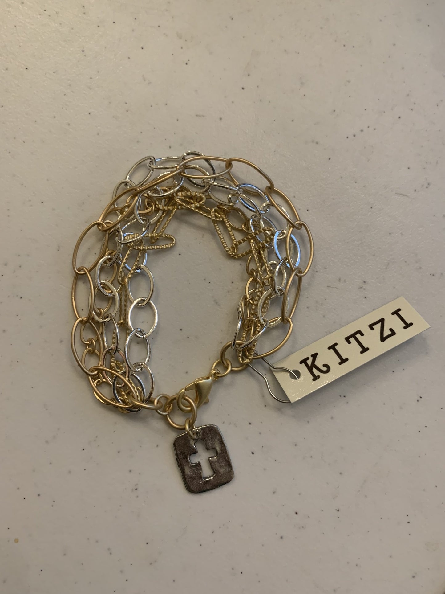 Kitzi Gold and Silver Multi Chain with Silver Cross charm Bracelet