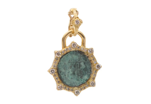 18k yellow gold artifact coin in teal patina with pointed halo in white diamonds. Enhancer Size 0